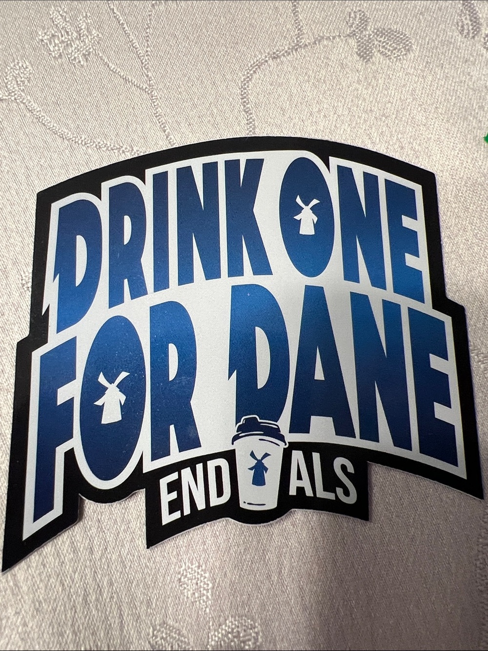 Dutch Bros Blue and White "Drink One For Dane" Sticker